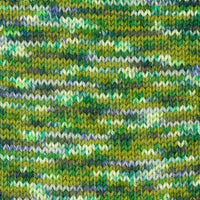 Close-up of a knitted fabric with green and blue speckled pattern