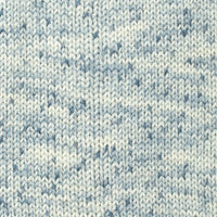 Close-up of a knitted fabric with a blue and white speckles