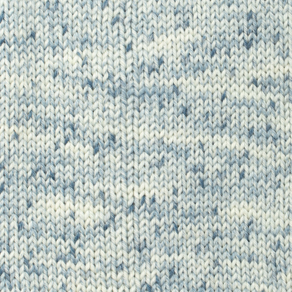Close-up of a knitted fabric with a blue and white speckles
