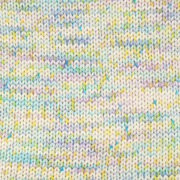 Close-up of cream coloured knitted fabric with pastel blues, yellow, and purple speckles