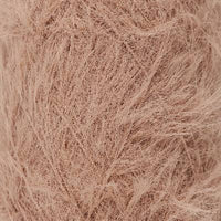 Close up detail of soft, furry light brown lace weight yarn