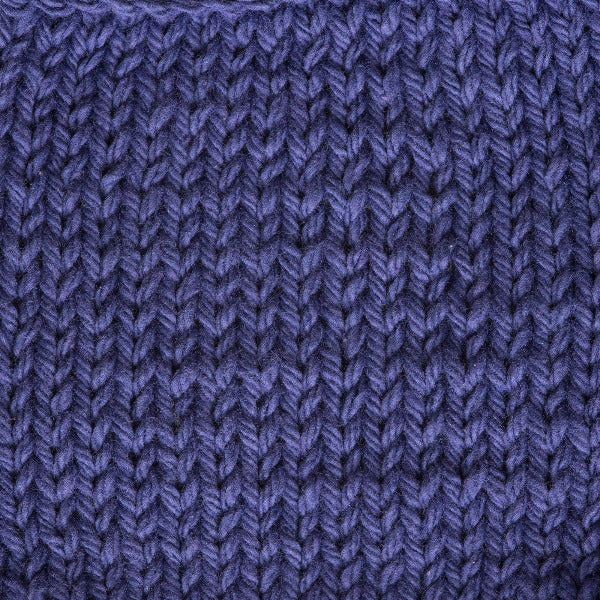 Close-up of a knitted purple fabric 