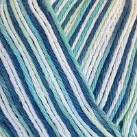 Close-up of variegated yarn in shades of mint, navy, blue, and white