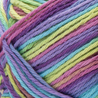 Close-up of a ball of colorful yarn in purple, pink, green, and blue.