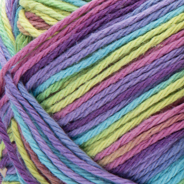 Close-up of a ball of colorful yarn in purple, pink, green, and blue.