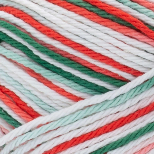 Close-up of multicolored yarn strands in red, green, and white.