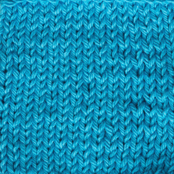 Close-up of blue knitted fabric texture