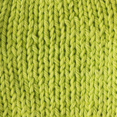 Close-up of acid green knitted fabric 