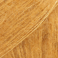 Close-up of mustard coloured lace yarn