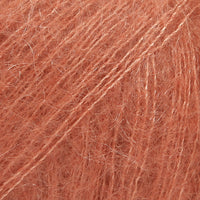 Close-up of rust coloured lace yarn