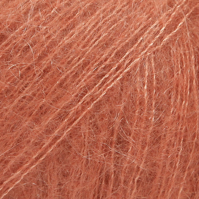 Close-up of rust coloured lace yarn