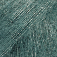 Close-up of light teal coloured lace yarn
