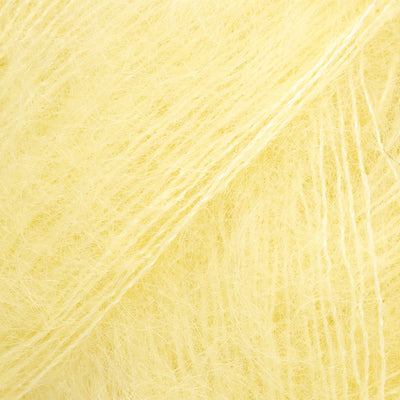 Close-up of pale yellow lace yarn