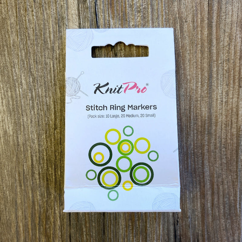 KnitPro Stitch Ring Markers packaging on a wooden surface
