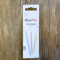 KnitPro wool needles packaging on a wooden surface