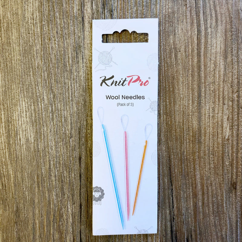 KnitPro wool needles packaging on a wooden surface