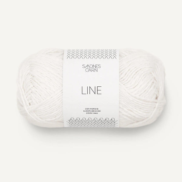 Ball of white yarn with Sandnes Garn label on a white background