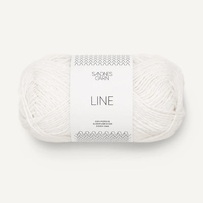 Ball of white yarn with Sandnes Garn label on a white background
