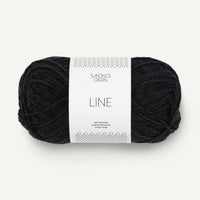 Black yarn ball with a label on a white background