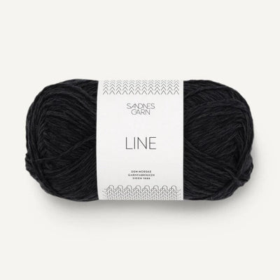 Black yarn ball with a label on a white background