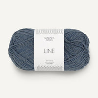 Blue skein of yarn with a label on a white background