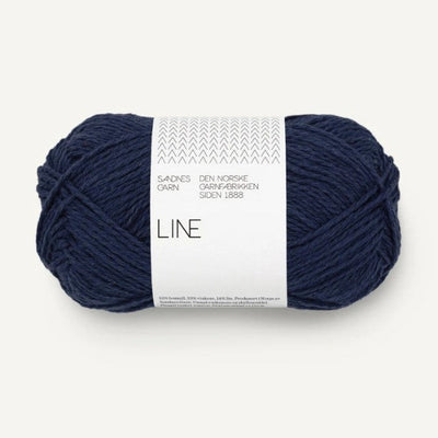 Dark blue skein of yarn with a label on a white background