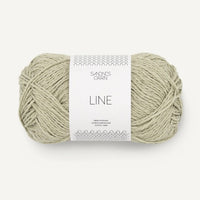 Ball of light green yarn with a 'Sandnes Garn' label on a white background