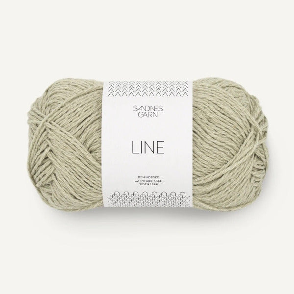 Ball of light green yarn with a 'Sandnes Garn' label on a white background
