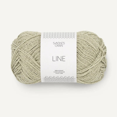 Ball of light green yarn with a 'Sandnes Garn' label on a white background