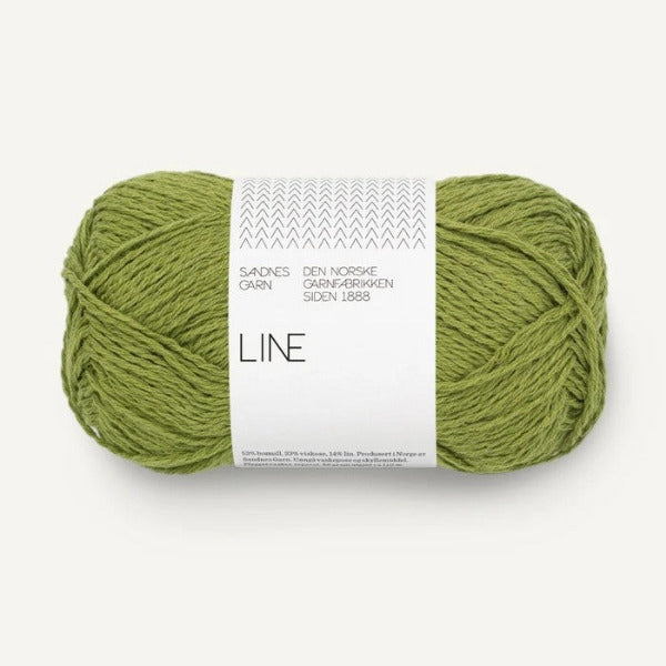 Green skein of yarn with a label on a white background