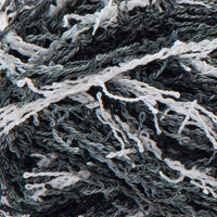 Close up of textured black, grey, and white yarn 