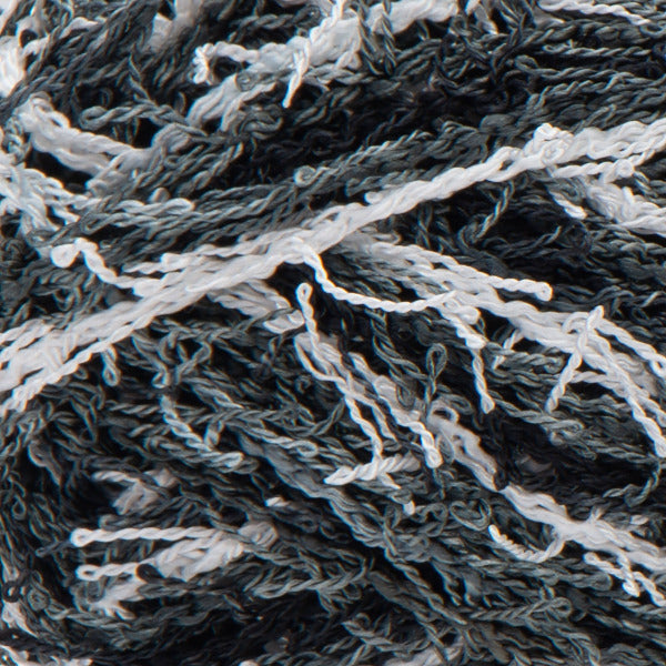 Close up of textured black, grey, and white yarn 