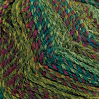 Close-up of variegated yarn with a chunky texture, showing blended shades of green, teal, and pink.