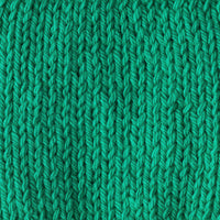 Close-up of a bright green knitted fabric 
