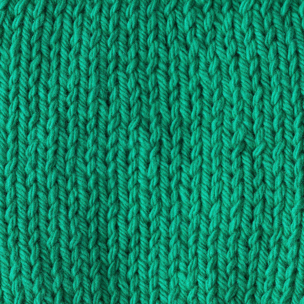 Close-up of a bright green knitted fabric 