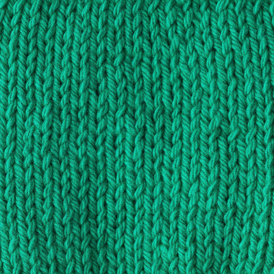 Close-up of a bright green knitted fabric 