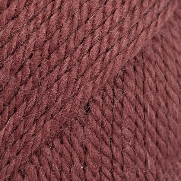 Close-up of reddish rust coloured yarn 