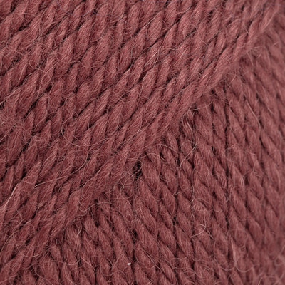 Close-up of reddish rust coloured yarn 