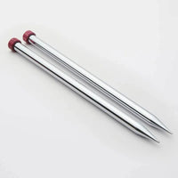Shiny silver knitting needles with red wood ends on a white background