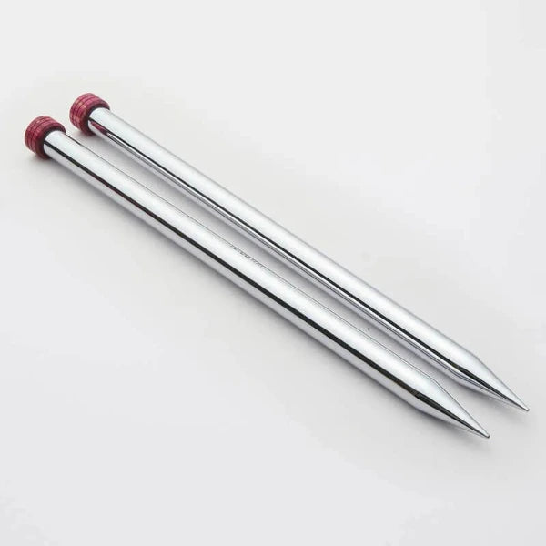 Shiny silver knitting needles with red wood ends on a white background