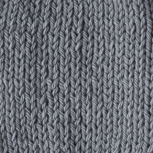 Close-up of a knitted gray fabric 