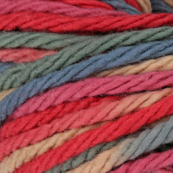 Close-up of multicolored yarn strands in red, pink, blue, grey, and tan