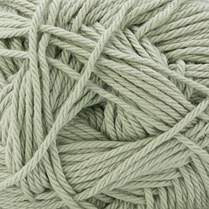 Close-up of a ball of light green yarn