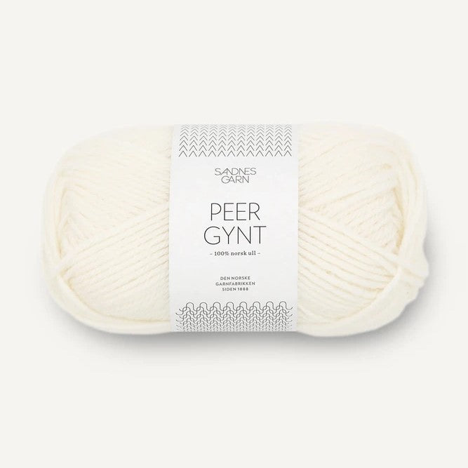 Ball of white yarn with a label on a white background