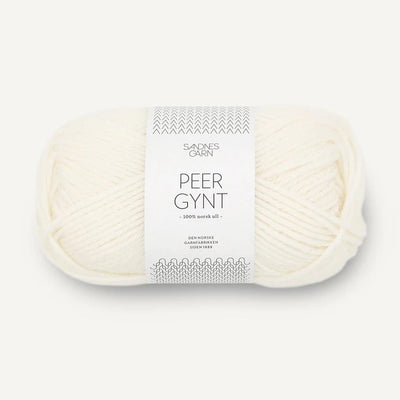Ball of white yarn with a label on a white background