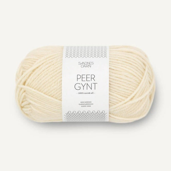 Ball of cream yarn with a label on a white background
