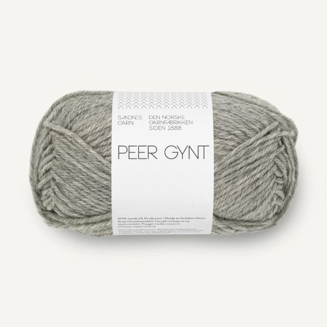 Ball of grey heathered yarn with a label on a white background