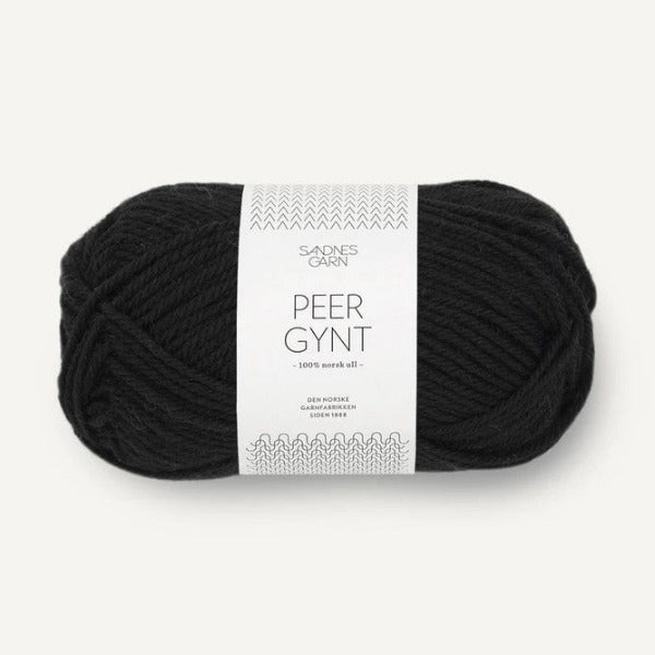 Ball of black yarn with a label on a white background