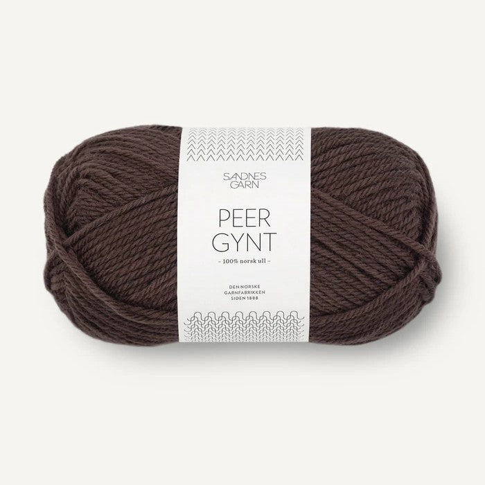 Brown ball of yarn with a label on a white background