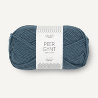 Blue ball of yarn with a label on a white background